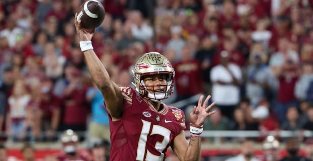 Florida State Seminoles quarterback Jordan Travis throws during a college football game in the ACC.